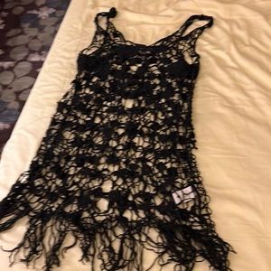 This is a black crocheted blouse by free people size medium